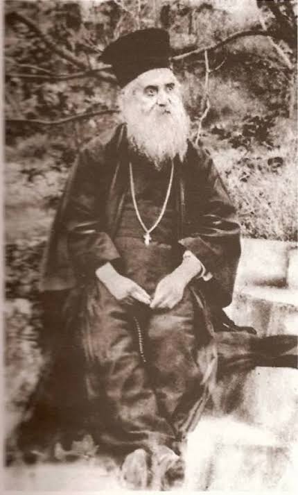 Saint Nectarios seated outdoors