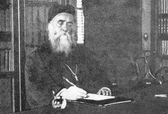 Saint Nectarios writing at a desk